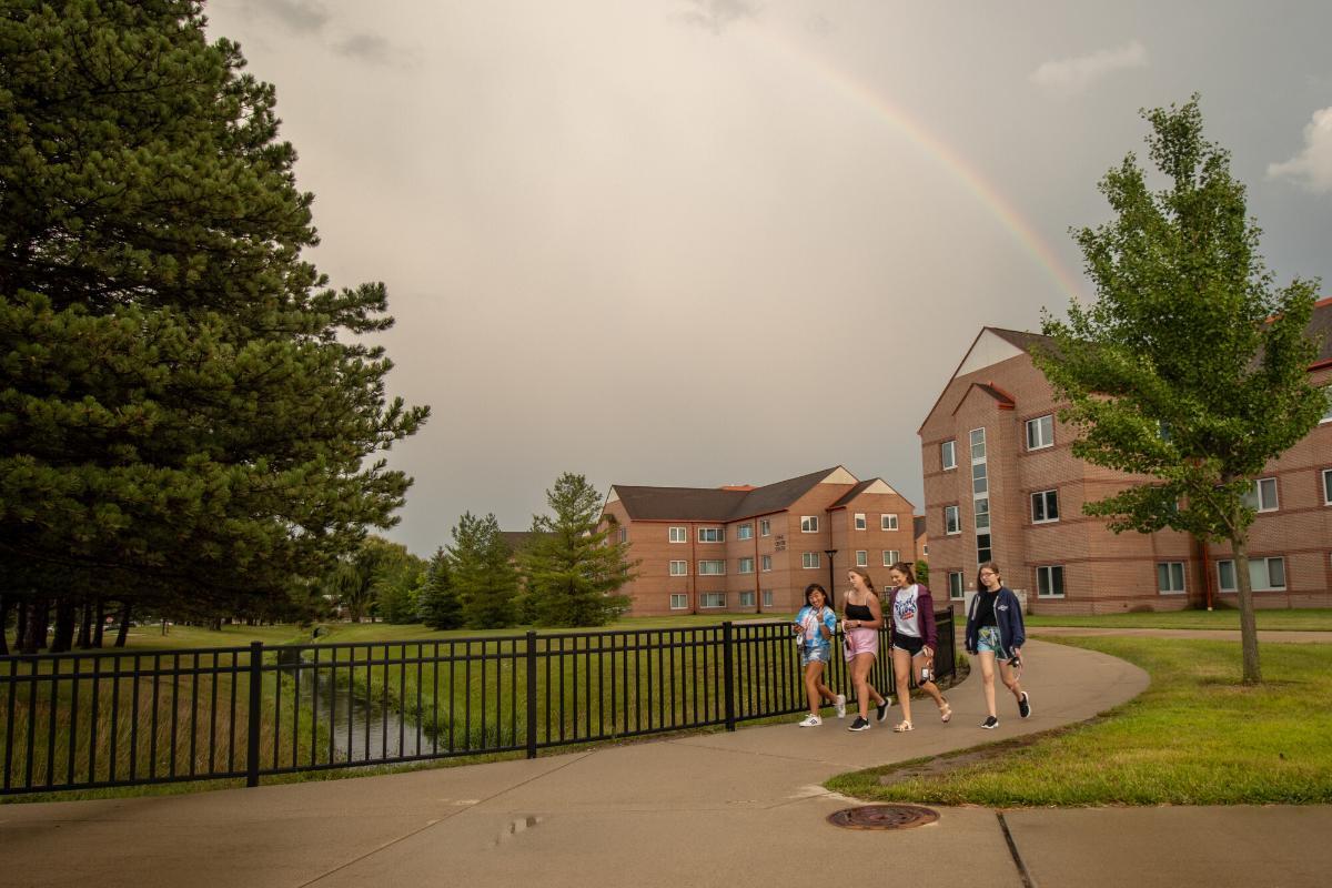 students walking and enjoying the beautiful scenery at SVSU housing